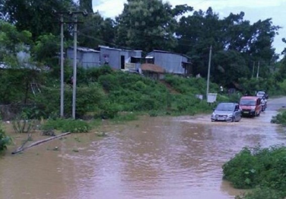 Gomati Dist. Hospital road flooded with knee-deep rain water, people suffer : District Administration in slumber 